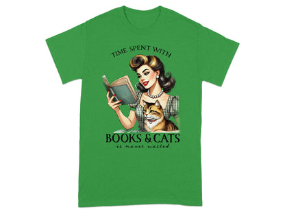 Green t-shirt with illustration of woman reading a book with a cat.