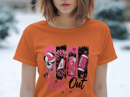 Orange t-shirt with "Pink Out" text and graphic of sports items with pink ribbons.