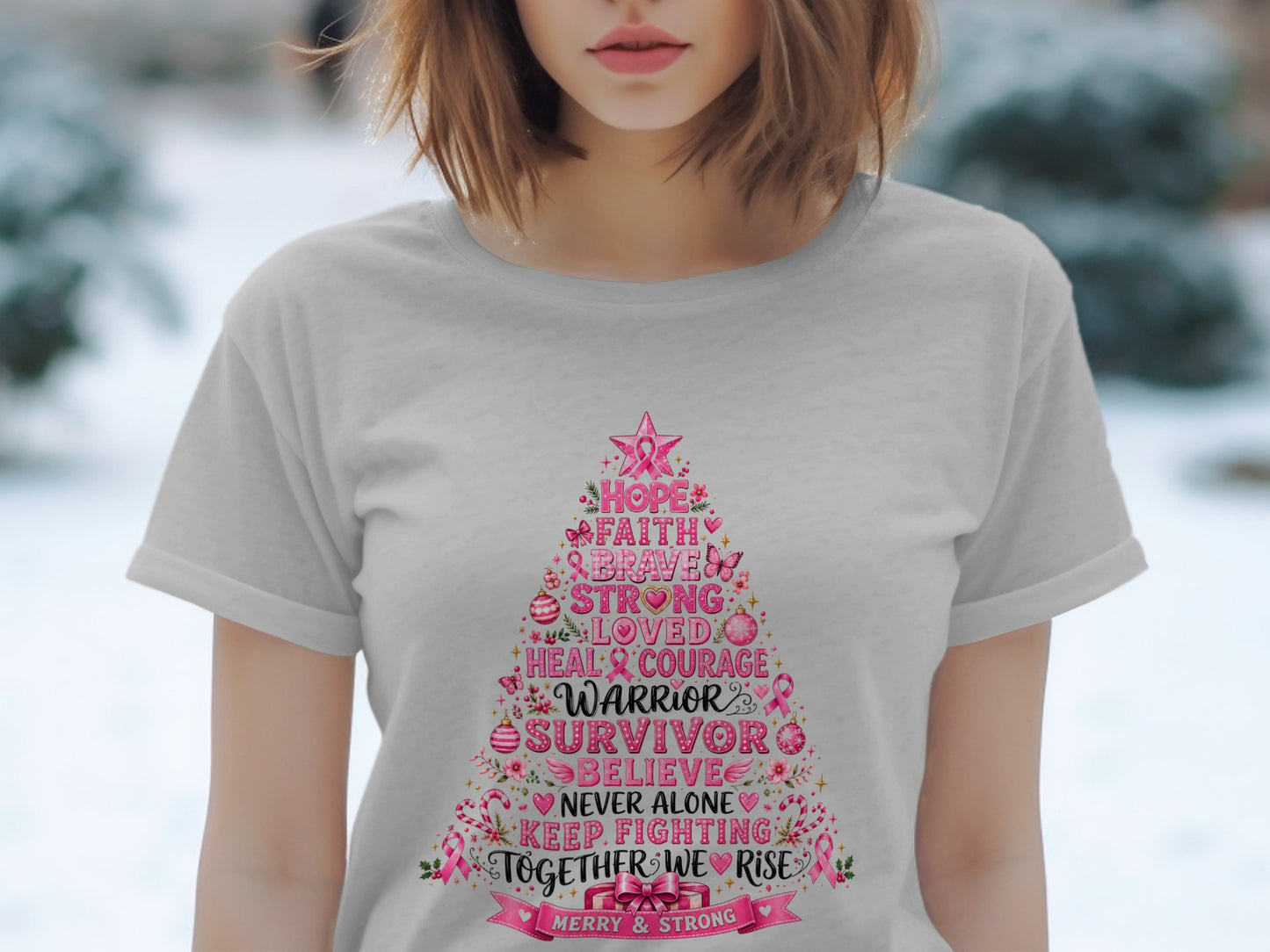 Grey t-shirt with a Christmas tree design featuring pink breast cancer awareness words.