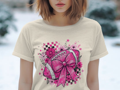 Pink football with bow and flowers on cream t-shirt