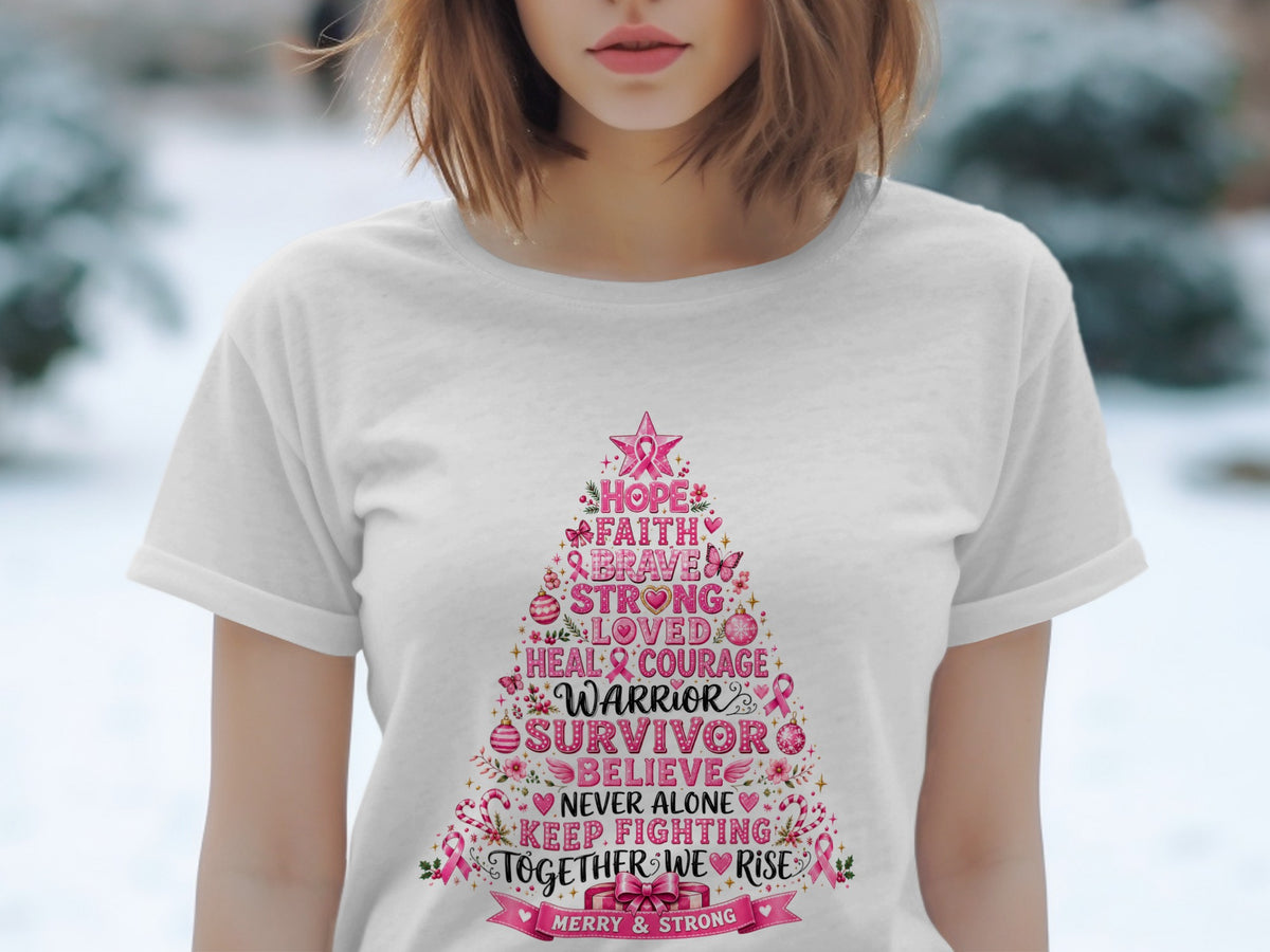 White t-shirt with a pink Christmas tree graphic listing breast cancer awareness words.