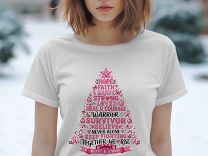 White t-shirt with a pink Christmas tree graphic listing breast cancer awareness words.
