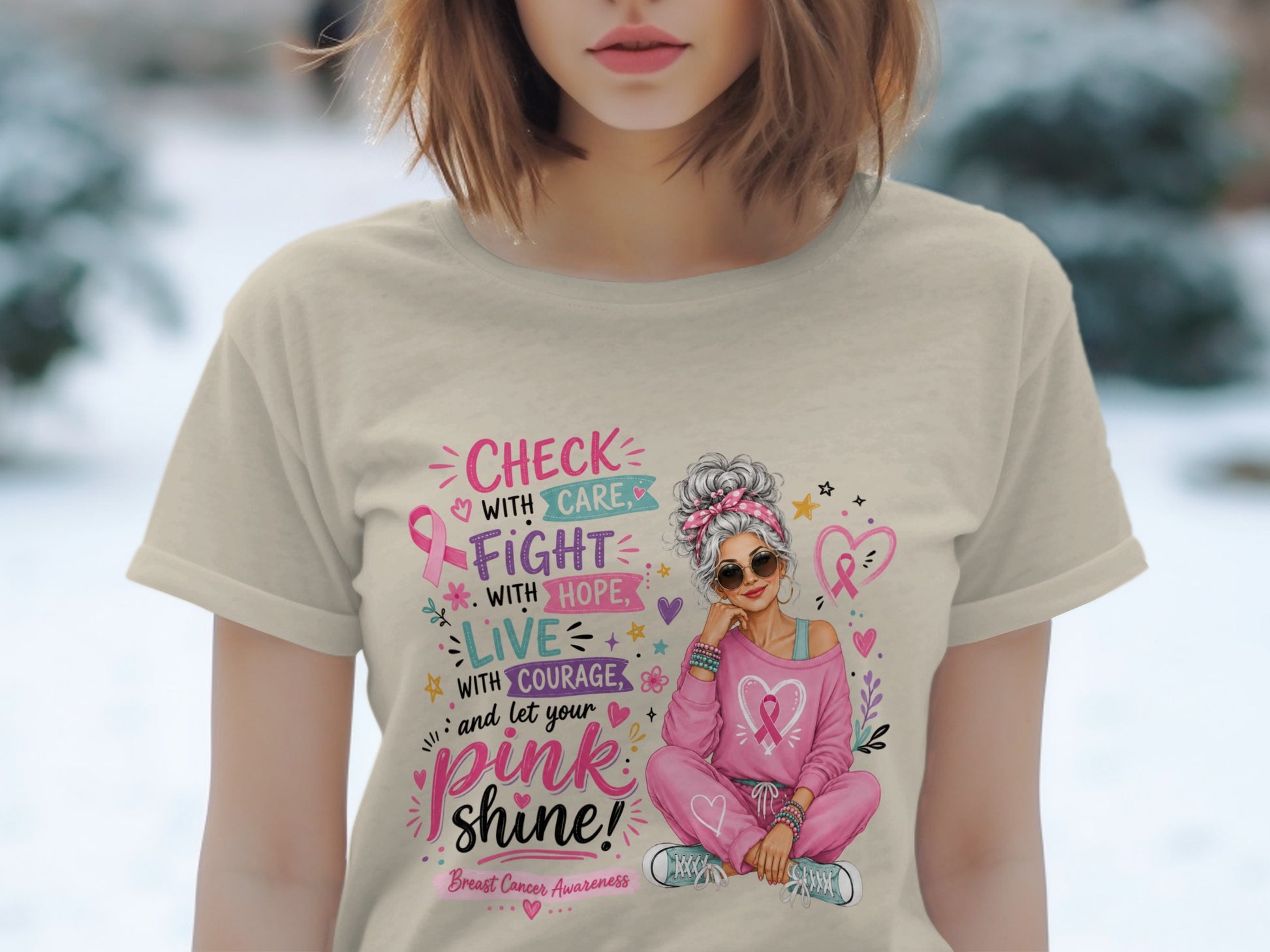 T-shirt with pink ribbon graphic and "Check with Care, Fight with Hope, Live with Courage, and let your pink shine!" text.