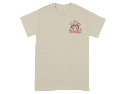Beige t-shirt with a graphic of a butterfly and text "Trust Your Visions".