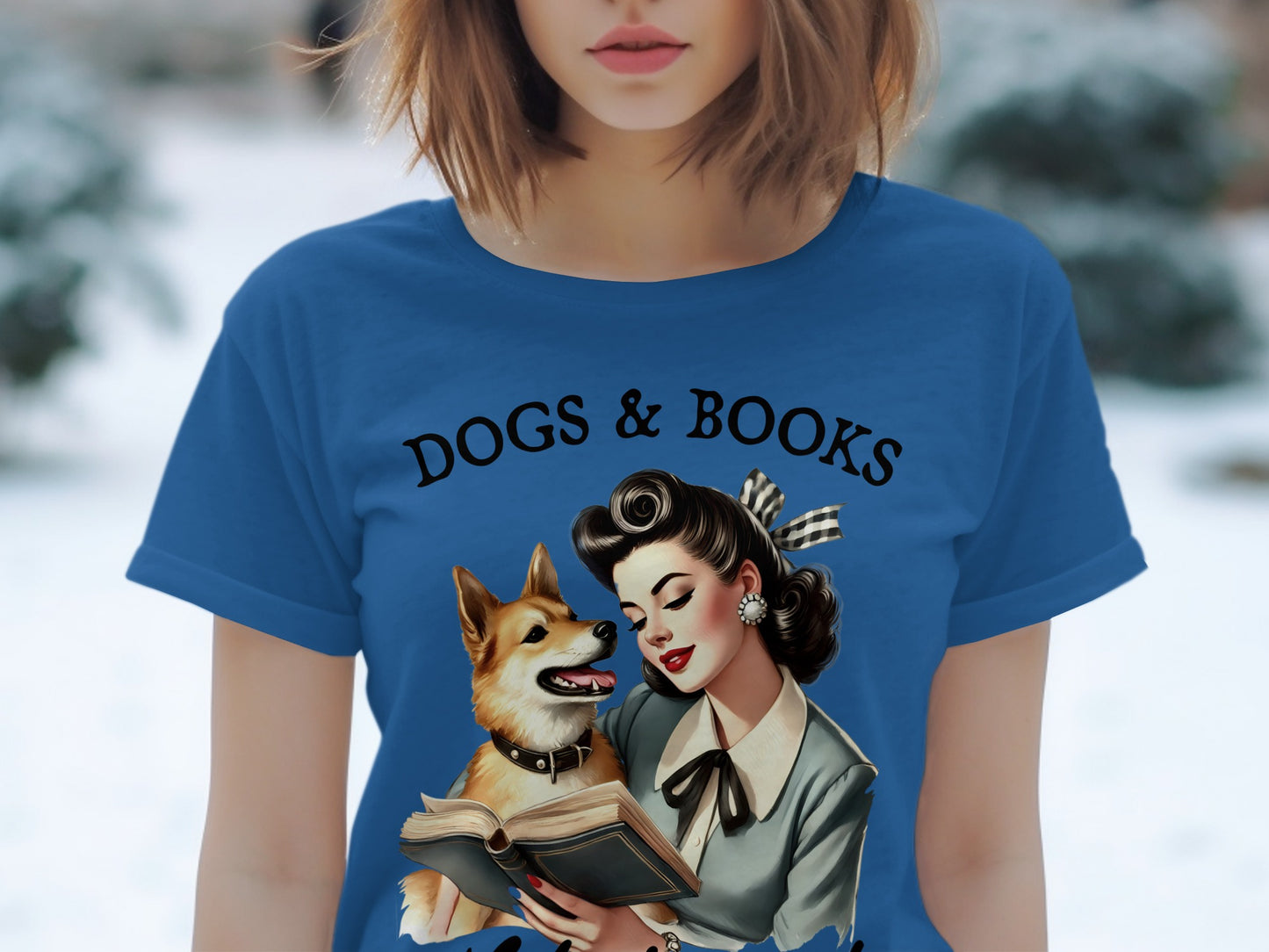 Blue t-shirt with "Dogs & Books" text and illustration of woman with dog reading.