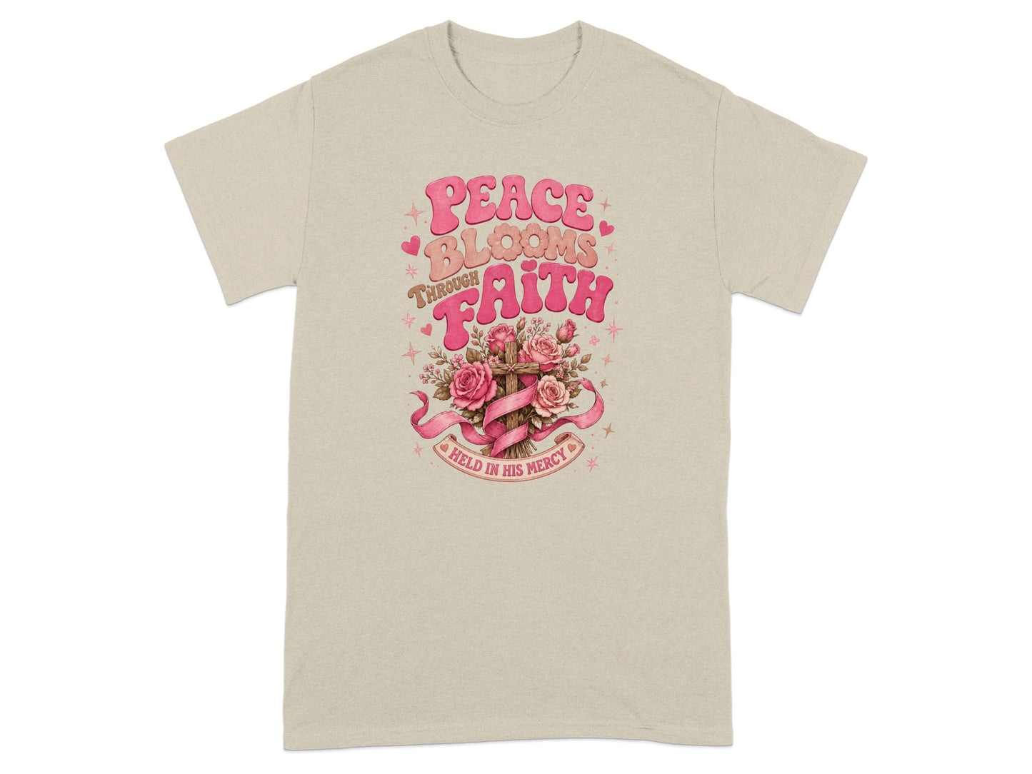 T-shirt with "Peace Blooms Through Faith Held in His Mercy" text and floral cross design.