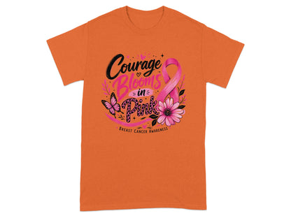 Orange t-shirt with pink ribbon and flowers, "Courage Blooms in Pink" text.