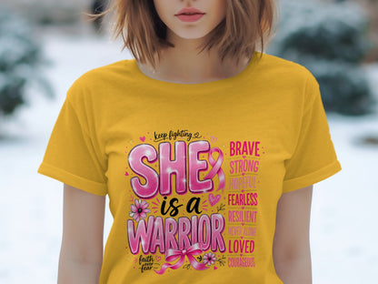 Yellow t-shirt with "SHE is a WARRIOR" and breast cancer awareness ribbon.