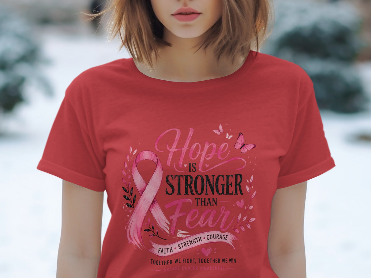 Red t-shirt with "Hope is Stronger Than Fear" and breast cancer awareness ribbon.
