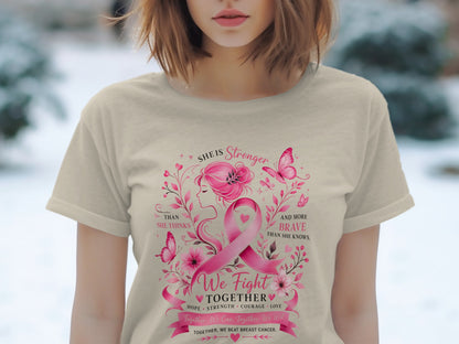T-shirt with pink breast cancer ribbon, floral design, and empowering text.
