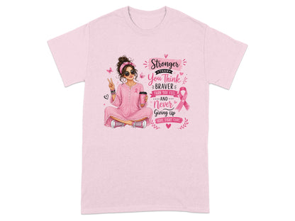 Pink t-shirt with woman holding coffee, peace sign, and breast cancer ribbon text.