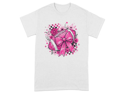 Pink football with bow and flowers against checkered background on a white t-shirt.