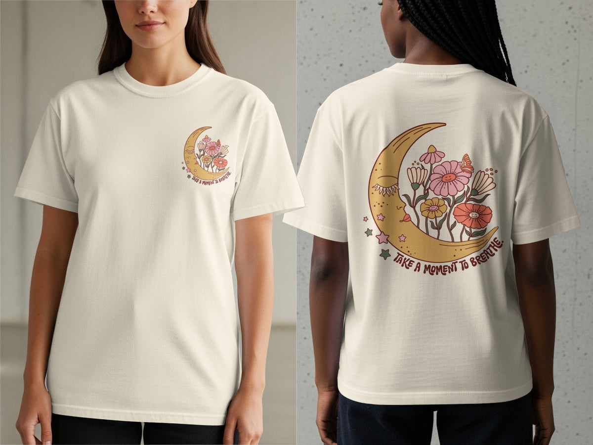 Cream t-shirt with a crescent moon, flowers, and text "TAKE A MOMENT TO BREATHE".
