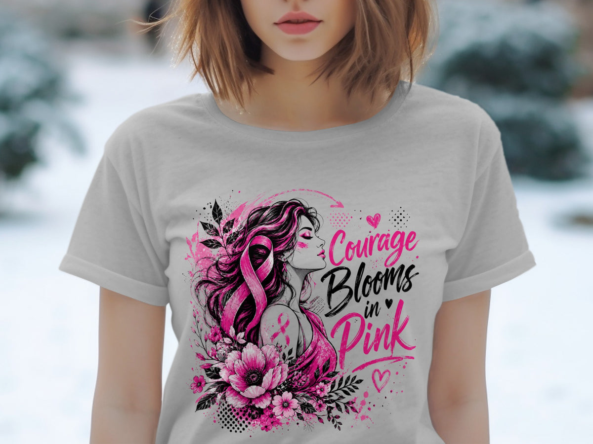 T-shirt graphic with woman, pink ribbon, flowers, and text "Courage Blooms in Pink."