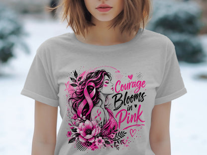 T-shirt graphic with woman, pink ribbon, flowers, and text "Courage Blooms in Pink."