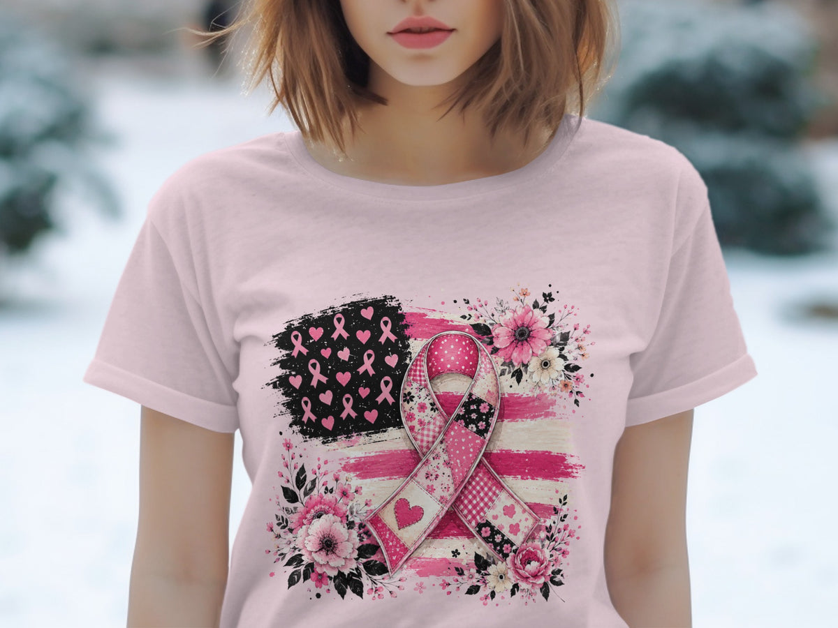 Pink t-shirt with a pink ribbon and floral design on a distressed flag background.