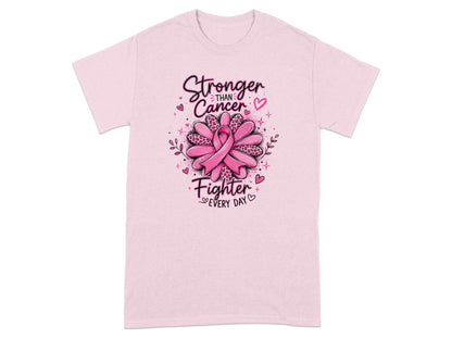 Pink t-shirt with "Stronger Than Cancer, Fighter Every Day" text and a pink ribbon flower.