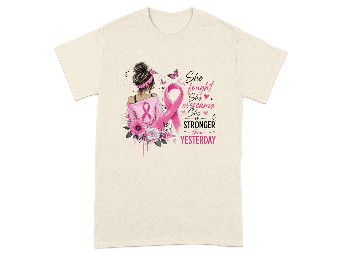 Cream t-shirt with "She fought, she overcame, she is stronger than yesterday" text and ribbon.