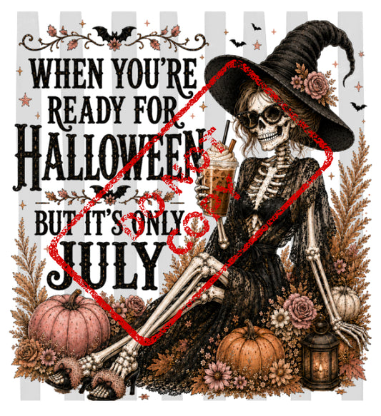 Skeleton in witch hat with drink, "When you're ready for Halloween but it's only July."