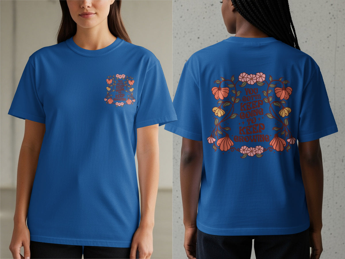 Blue t-shirt with floral design and text: "You gotta keep going to keep growing".