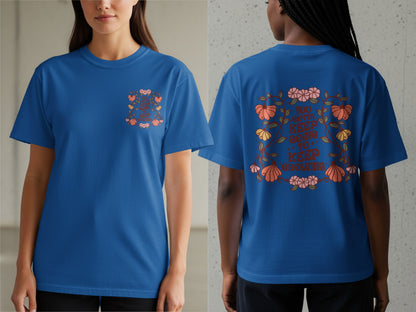 Blue t-shirt with floral design and text: "You gotta keep going to keep growing".