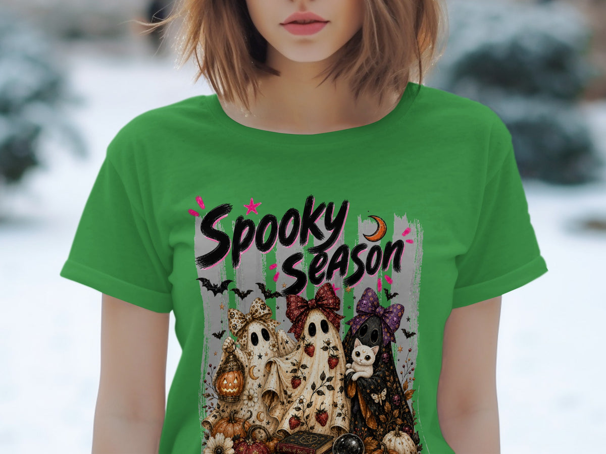 Green t-shirt with "Spooky Season" text and three ghosts with bows, a cat, and pumpkins.