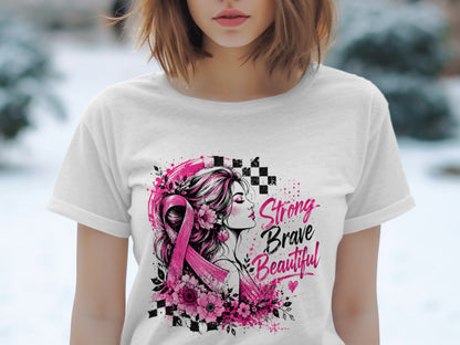 White t-shirt with a graphic of a woman, pink ribbon, flowers, and text "Strong Brave Beautiful".