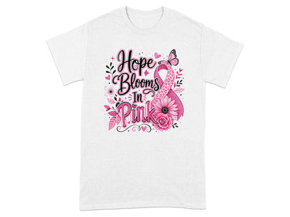 White t-shirt with "Hope Blooms In Pink" text and pink ribbon design.