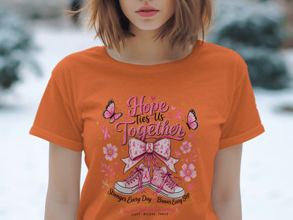 Orange t-shirt with "Hope Ties Us Together" breast cancer awareness design.