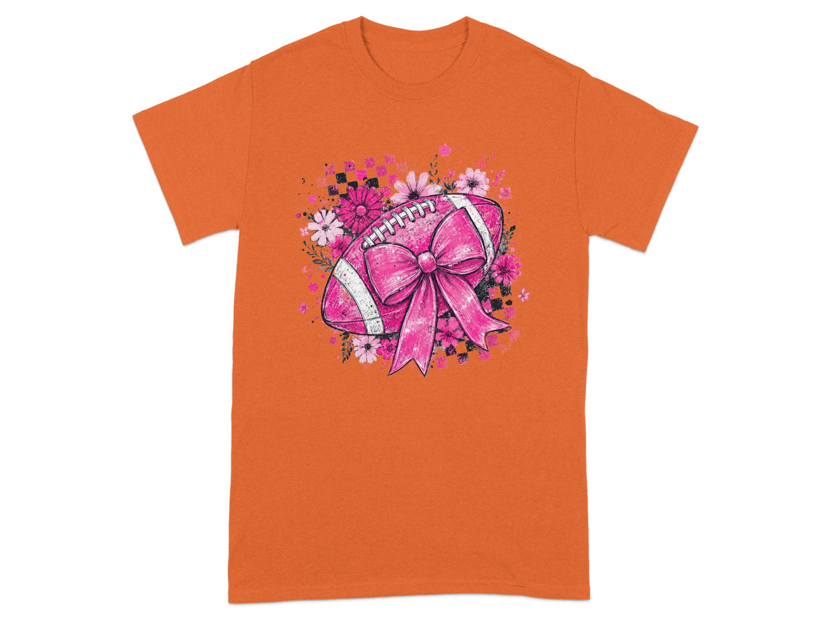 Orange t-shirt with pink football, bow, flowers, and checkered background design.