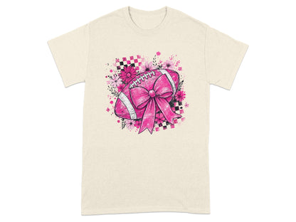 Pink football with bow and flowers on a light-colored t-shirt.