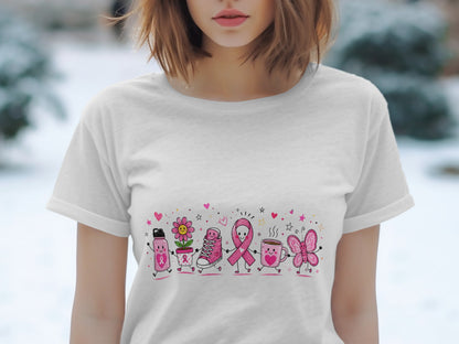 White t-shirt with cartoon characters, breast cancer ribbon, and pink accents.