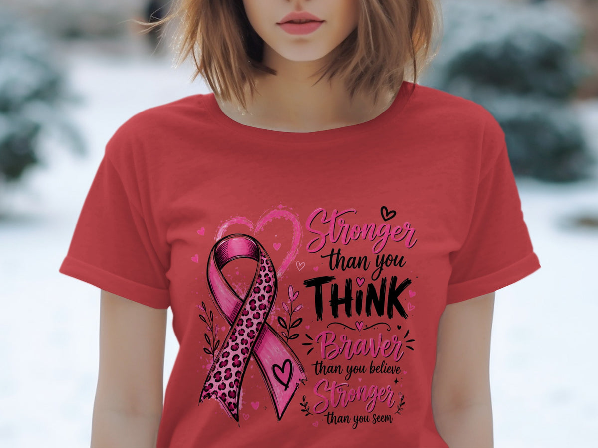 Red t-shirt with pink breast cancer ribbon and "Stronger than you THINK, Braver than you believe, Stronger than you seem."
