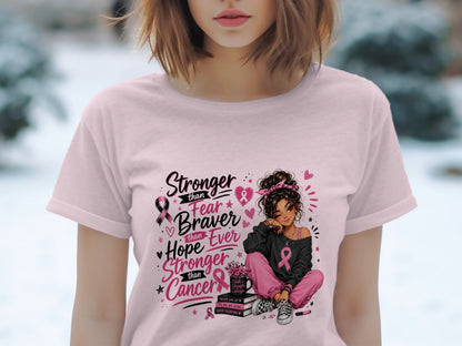 Pink t-shirt with a design of a girl and the text "Stronger than Fear, Braver than Hope, Ever Stronger than Cancer".