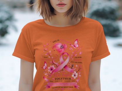 Orange t-shirt with pink breast cancer ribbon, butterflies, flowers, and text.