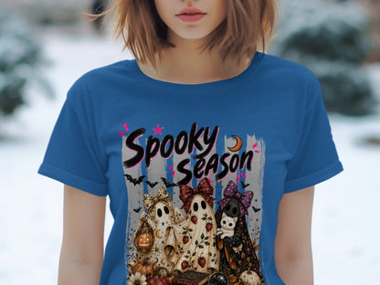 Blue t-shirt with "Spooky Season" text and ghosts, a cat, and Halloween decorations.