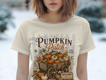 T-shirt graphic with "Pumpkin Patch" text and a wooden cart full of pumpkins.