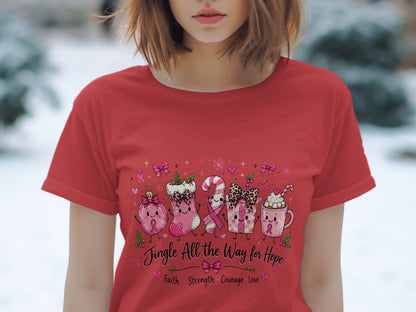 Red t-shirt with cartoon Christmas ornaments, candy cane, gift, and hot cocoa with pink ribbons.