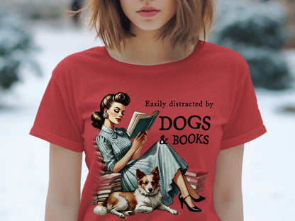 Red t-shirt with retro woman reading book next to dog and text "Easily distracted by DOGS & BOOKS."