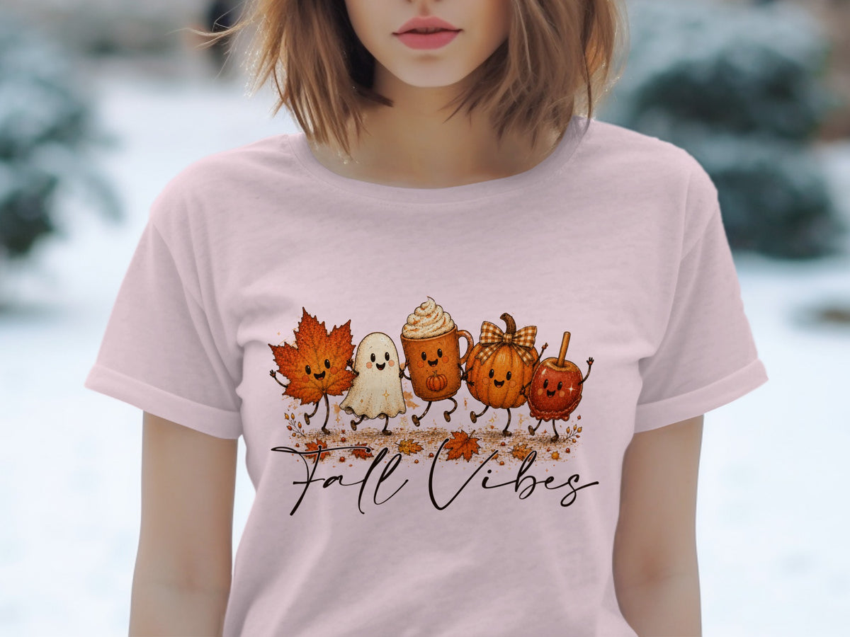 T-shirt with a "Fall Vibes" graphic of cartoon fall characters and leaves.