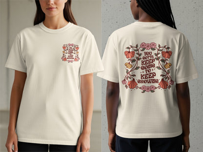 Cream t-shirt with floral design and text "You gotta keep going to keep growing".