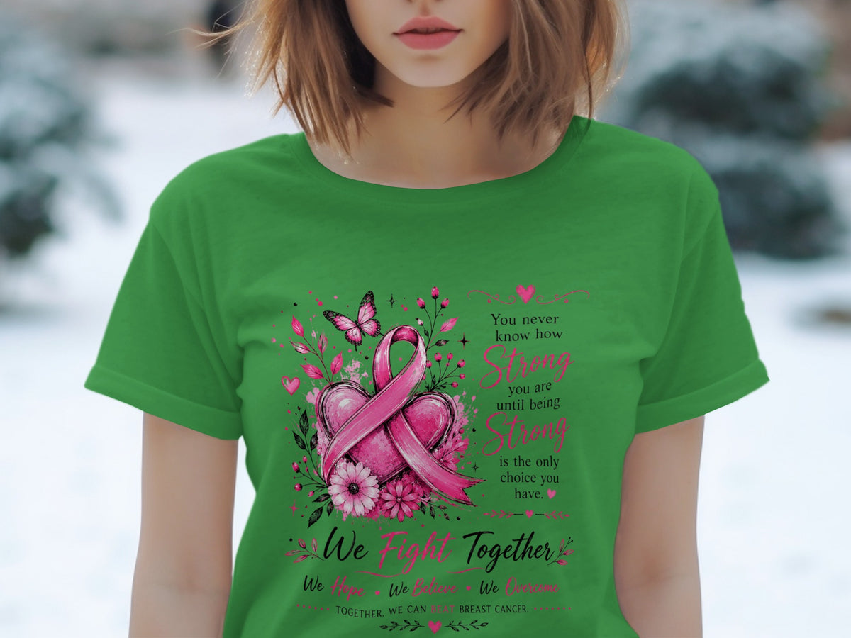 Green t-shirt with breast cancer ribbon, hearts, flowers, butterfly, and empowering text.