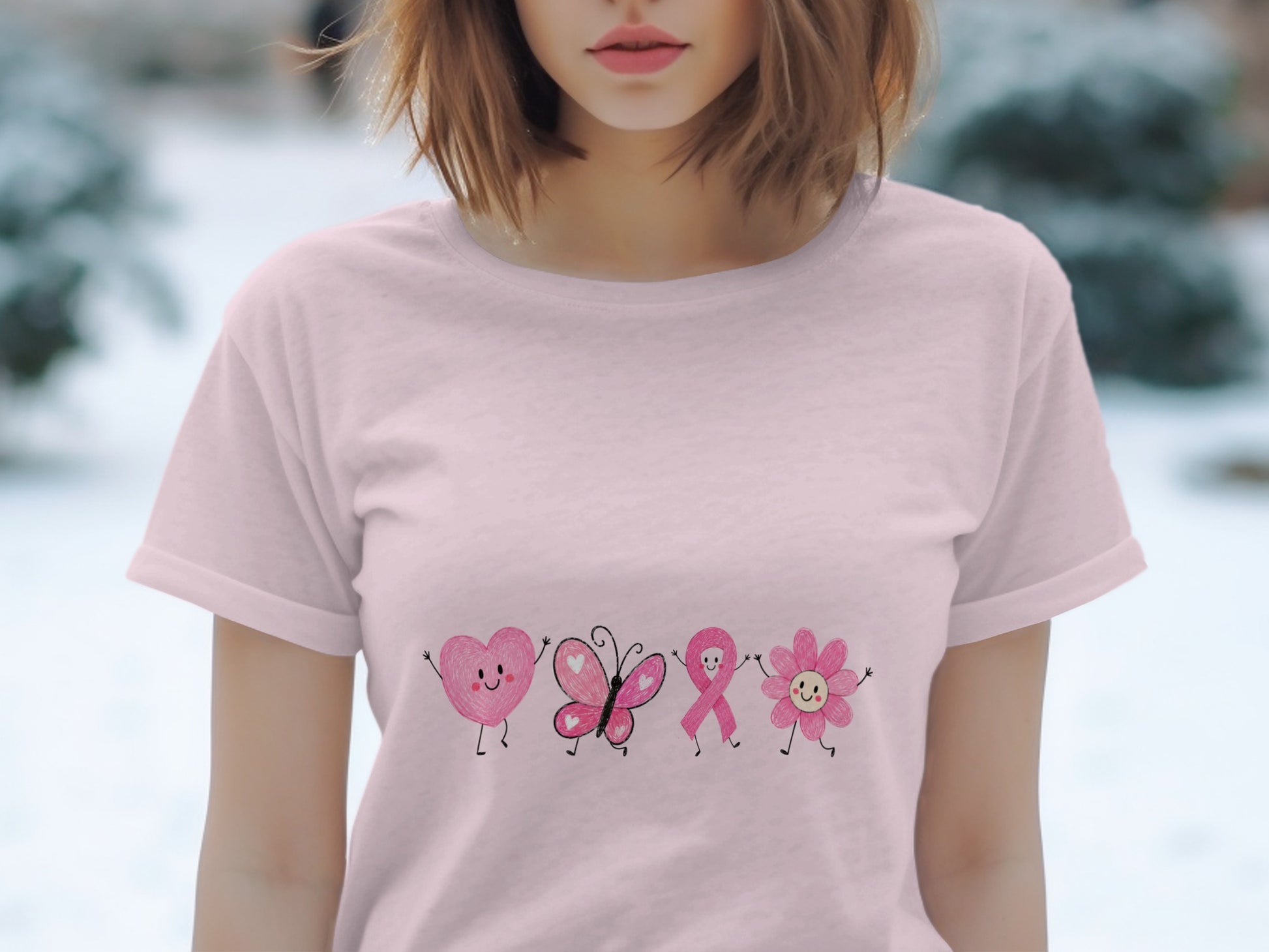 Pink t-shirt with cartoon heart, butterfly, ribbon, and flower designs.
