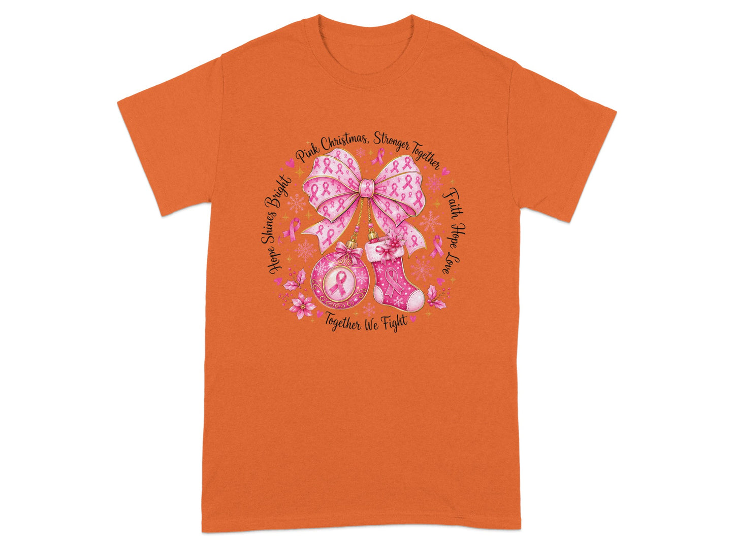 Orange t-shirt with circular graphic of pink ribbons, bow, ornament, and stocking.