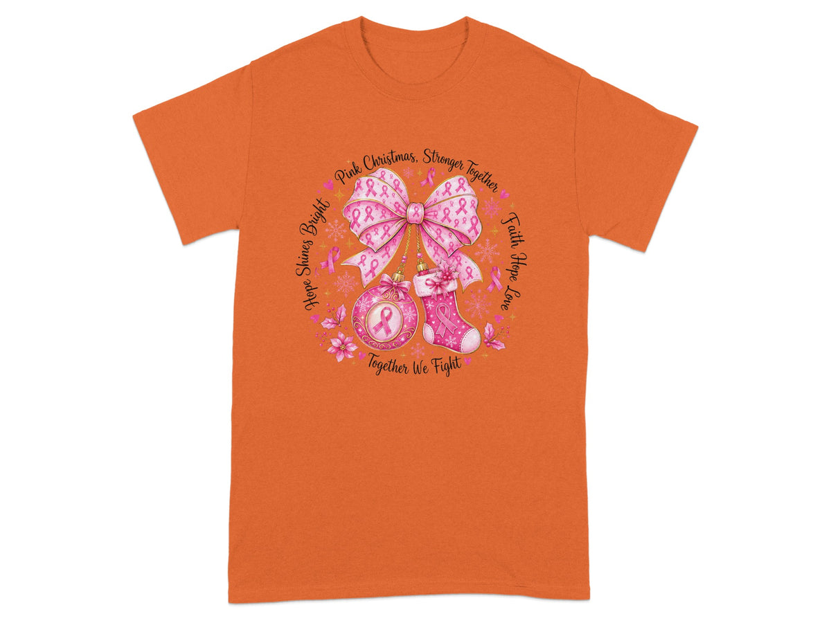 Orange t-shirt with circular graphic of pink ribbons, bow, ornament, and stocking.