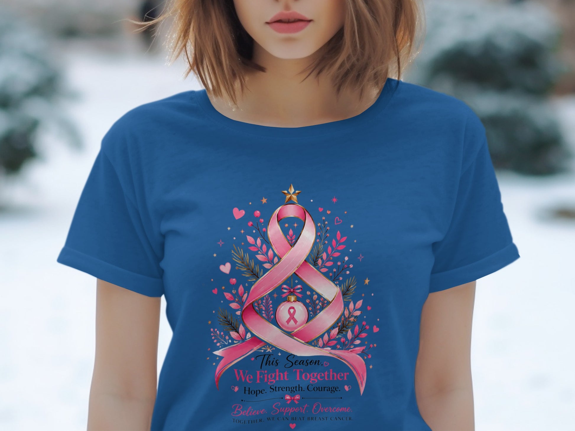 Blue t-shirt with pink ribbon tree design and breast cancer awareness text.