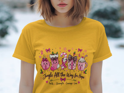 Yellow t-shirt with Christmas-themed characters, pink ribbons, and the text "Jingle All the Way for Hope".