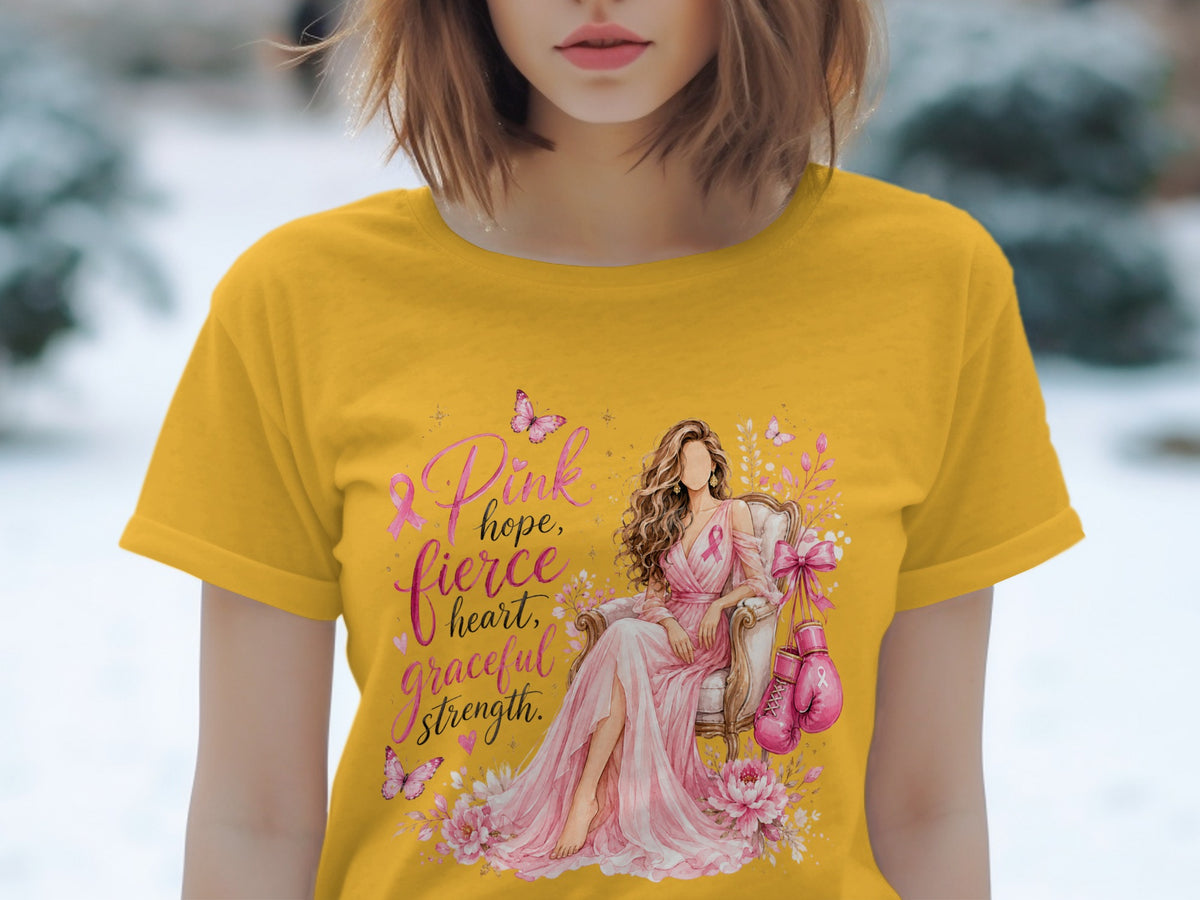 Yellow t-shirt with pink ribbon, woman in chair, boxing gloves, and text.