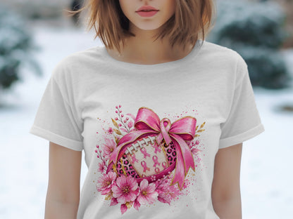 White t-shirt with a pink ribbon, football, and floral graphic.