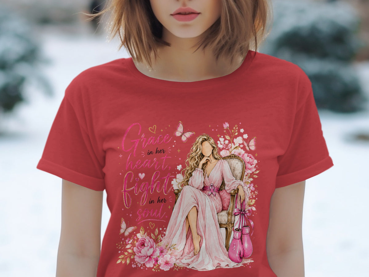 Red t-shirt with watercolor art of a woman sitting, boxing gloves, and text "Grace in her heart, Fight in her soul."